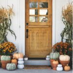 Decorating a porch for fall with pumpkins mums lanterns and autumn wreath